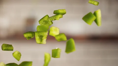 Chopped green pepper jumping in slow motion Stock Footage 152903694