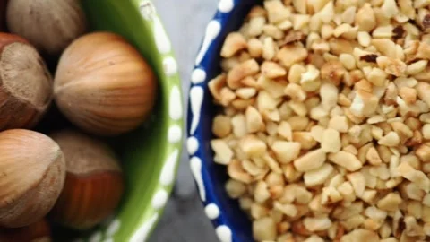 Chopped hazelnuts In A Blue Bowl Closeup For Baking, Topping And Snack Recipes Stock Footage 340727260