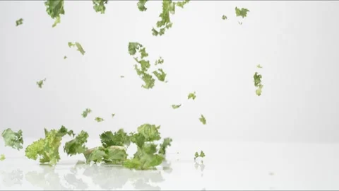 Chopped Kale Bouncing Slow Motion White Tabletop Closeup Macro Food Studio Stock Footage 335003644