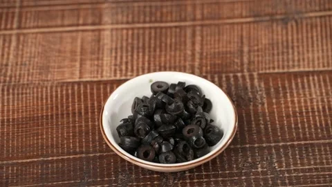 Chopped olives on plate Stock Footage 183501701