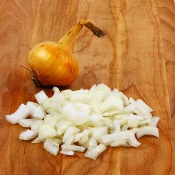 Chopped onion on board Stock Photos