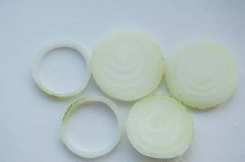 Chopped onion in the form of the Olympic rings Stock Photos