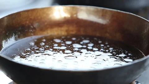 Chopped onions are fried in a pan close-up Stock Footage 248538533