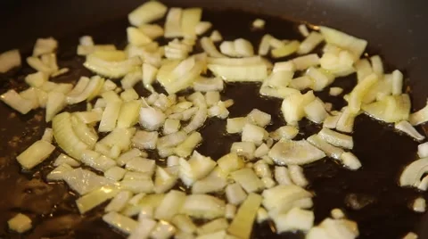 Chopped onions being fried Stock Footage 49237429
