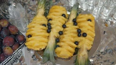 Chopped pineapple on buffet table Stock Footage 148157503