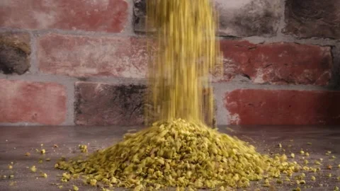 Chopped Pistachio Nuts Falling on Fake Marble Table - 4K Slow Motion Stock Footage 334780706