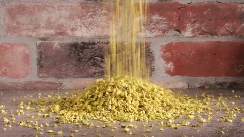 Chopped Pistachio Nuts Falling on Fake Marble Table - Take 2 - 4K Slow Motion Stock Footage 334780897