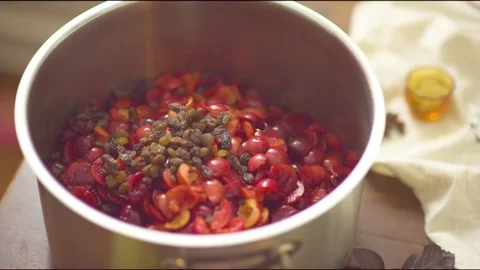 Chopped plum on cooking pot Stock-Footage 76140349