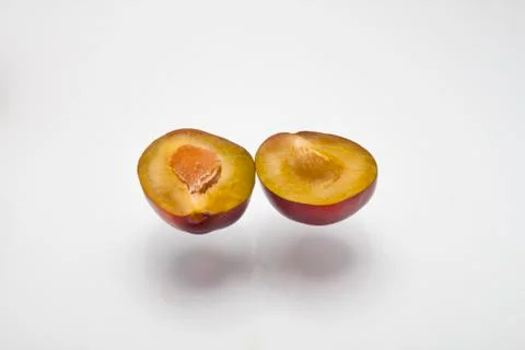 Chopped plum on a white background Stock Photos