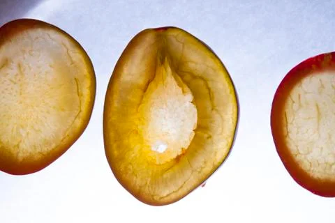 Chopped plum on a white background Stock Photos
