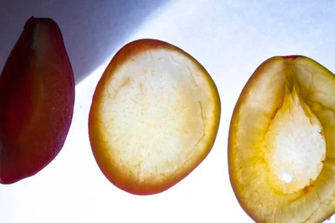 Chopped plum on a white background Stock Photos