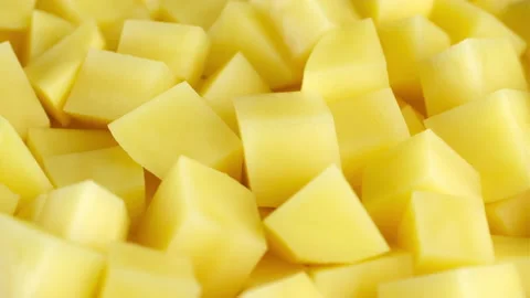 Chopped potatoes close up. Process cooking potato Stockbeeldmateriaal 239323132