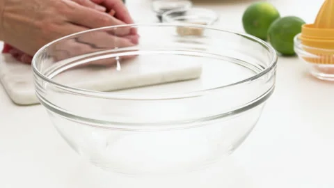 Chopped raw pork meat. Chef puts meat off cutting board into a glass board.  Stock Footage 131758394