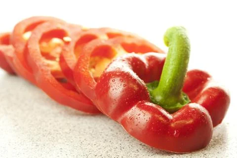 Chopped red bell pepper isolated on white Stock-Fotos