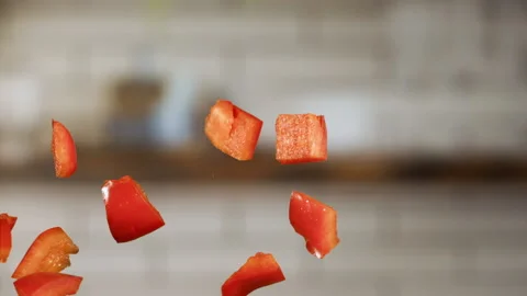 Chopped red pepper jumping in slow motion Stock Footage 152903081