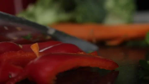Chopped red pepper with a kitchen knife 스톡 동영상 137211305