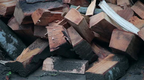 Chopped split firewood, pile of dry logs, store, outdoors, tilt up Stock Footage 52605659