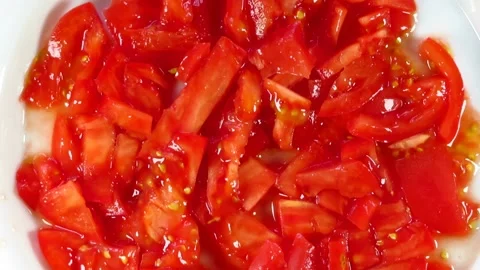 Chopped Tomato on a dish Stock Footage 134748675