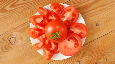 Chopped tomato on a plate. Stock Footage 245681402