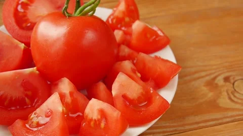 Chopped tomato on a plate. Video stock 247392039