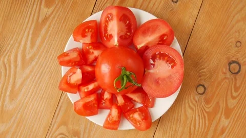 Chopped tomato on a plate. Video stock 247484267