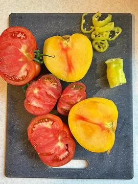 Chopped tomatoes on a board Stock Photos