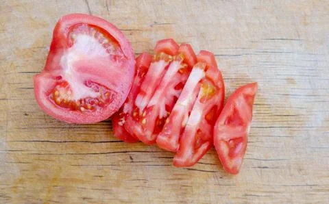 Chopped tomatoes on a cutting board Stock Photos