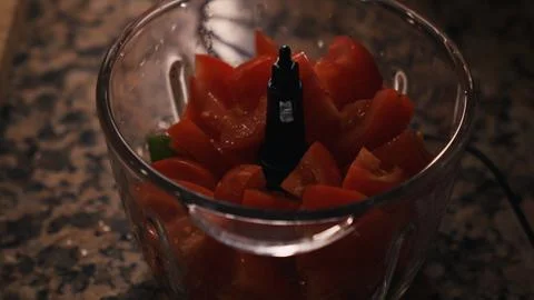 Chopped tomatoes in food processor. Stock Photos