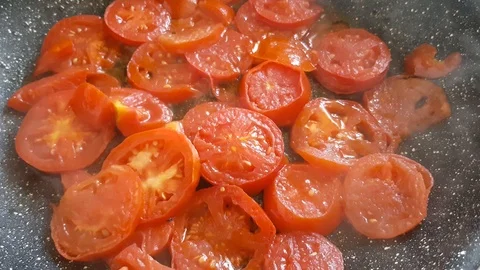 Chopped tomatoes in a frying pan Stock Footage 95793653