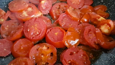 Chopped tomatoes in a frying pan Stock Footage 97528476