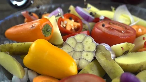 Chopped vegetables are sprinkled with a mixture of peppers 動画素材 105418076