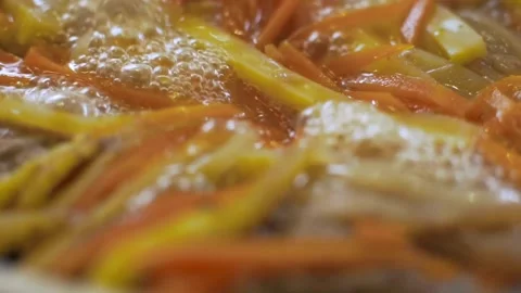 Chopped vegetables boiling in a pot for healthy stew Stock-Footage 333833144