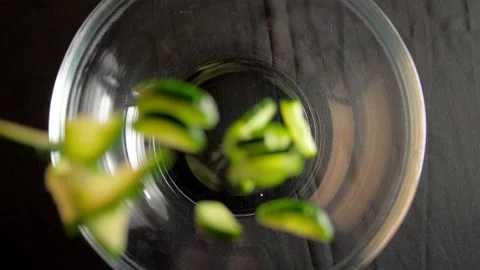 Chopped vegetables fall on the dishes Stock Footage 132080993
