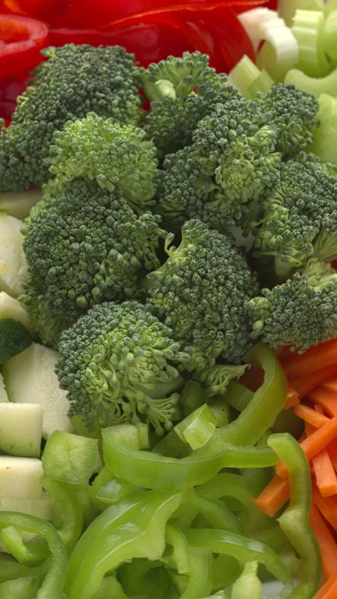 Chopped vegetables. Seamless loop, vertical video. Stock Footage 277603229