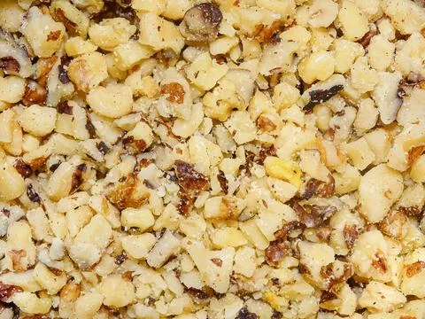 Chopped walnut kernels. Walnut background Stock Photos