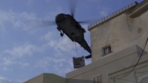 Chopper Carrying a Chest Stock Footage 78534597