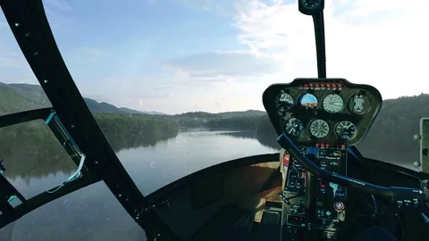 Chopper flying over a lake 스톡 동영상 73806745