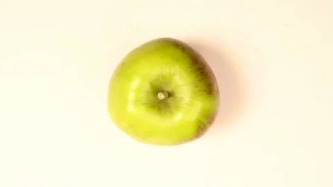 Chopping apple on white background. Animation. Stock Footage 136468486