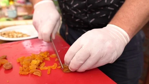 Chopping Apricots  by Chef Stock Footage 123932353