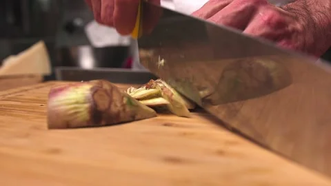 Chopping artichokes Stock Footage 136372581