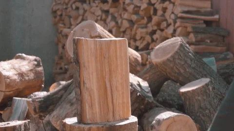 Chopping ax with a log in slow motion Stock Footage 127714191