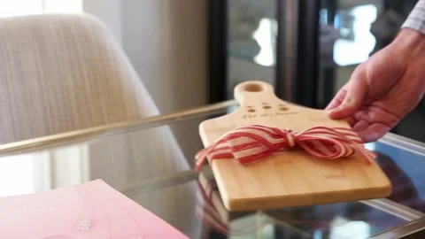 Chopping Board Gift Put On A Glass Table Video stock 132004669