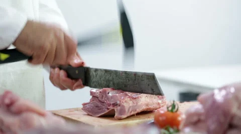 Chopping bones of turkey with hammer and axe Stock Footage 30625442