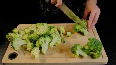 Chopping Broccoli on Bamboo Board in Cooking Studio Stock Footage 341444932