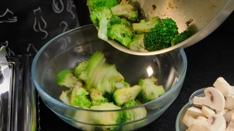 Chopping Broccoli in Cooking Kitchen with Chalkboard Video stock 341427877