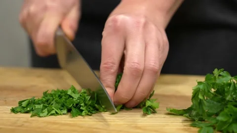 Chopping a bunch of parsley Stock Footage 155569928