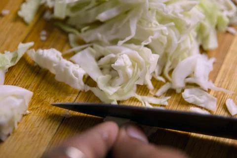 Chopping Cabbage on Board Stock Photos