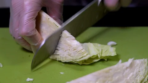 Chopping cabbage vegetable with a knife Stock Footage 111330535
