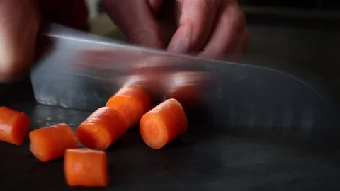 Chopping carrots with a knife Stock Footage 172512380