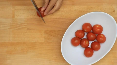 Chopping cherry Tomatoes Stock Footage 122812752